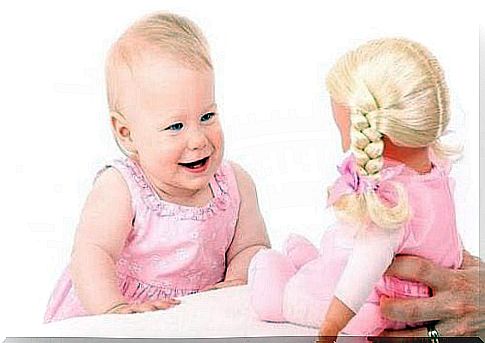 The baby learns to laugh and smile by imitating other people